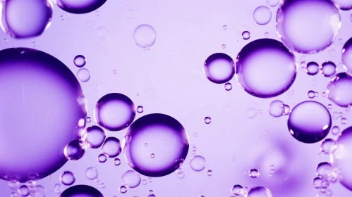 Purple Bubbles Floating in Clear Liquid