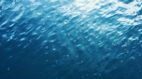 Blue Water Surface with Small Waves and Bubbles