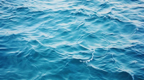 Blue Sea Waves and Sunlight Reflection