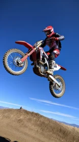 Motocross Rider Jumping Dirt Bike - Action Shot