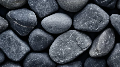 Smooth Water-Worn Stones on Black Background