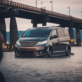 Enigmatic Black Minivan Parked Below Bridge | Captivating Fusion of Traditional and Modern Elements