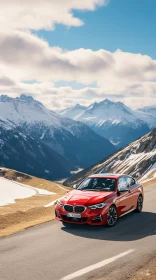 Red BMW 3 Series Driving near Snow-Covered Mountains - A Captivating Image