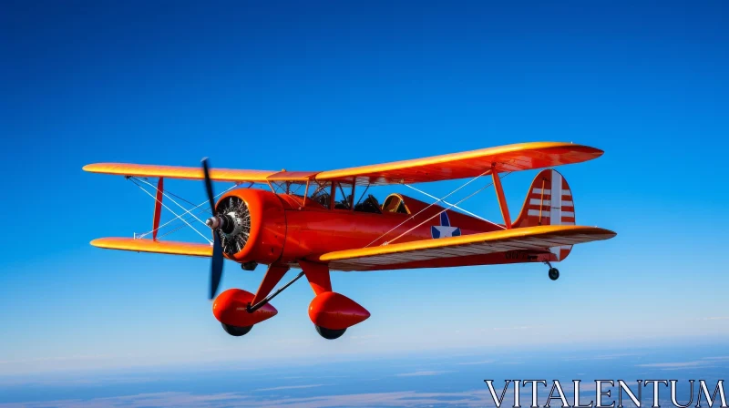 Red Biplane Flying in Clear Blue Sky AI Image