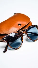 Stylish Brown Sunglasses with Blue Lenses on Leather Case