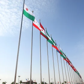 Row of National Flags Under Azure Sky