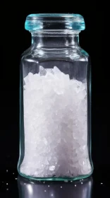 Captivating Image of Salt in Glass Jar Against Black Backdrop