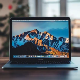 Sleek Laptop featuring Mountain Peaks Wallpaper