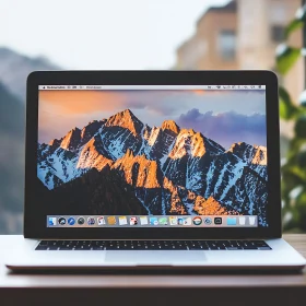 Laptop with Mountain Landscape Wallpaper