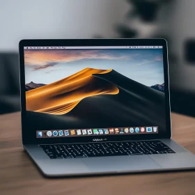 Sleek Laptop Displaying Desert Dune at Sunset