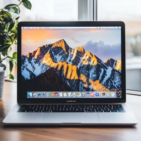 Laptop with Mountain Wallpaper in Calm Workspace