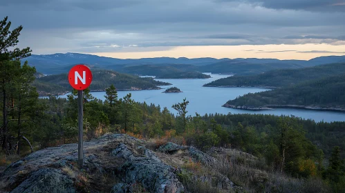 Calm Nature Scene with Lake and Red Sign
