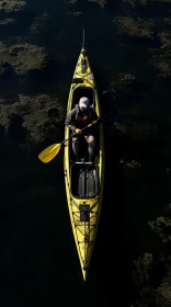 Yellow Kayak on Calm Waters: A Captivating Aerial View