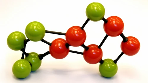 Green and Red Spheres of a Chemical Structure on a White Surface - Dark Orange and Black Style