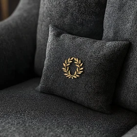 Luxury Black Sofa with Gold Emblem Pillow