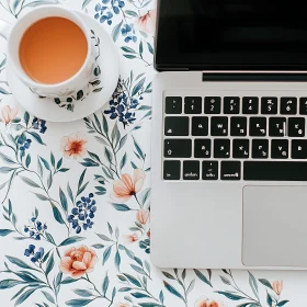 Stylish Floral-Inspired Workspace with Laptop and Tea
