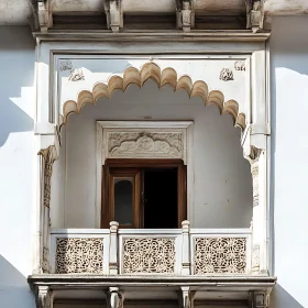 Intricate Carved Balcony with Open Window