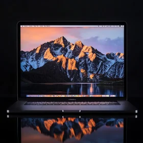 Mountain Range at Sunset on Laptop Screen