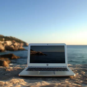 Serene Ocean Sunset Displayed on Laptop