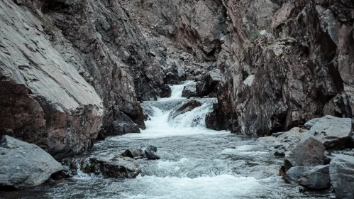 Tranquil River Flow Amidst Rugged Rocks