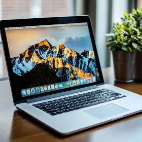 Contemporary Desk Setup with Laptop and Nature Background