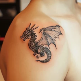 Black Ink Dragon Tattoo on Shoulder