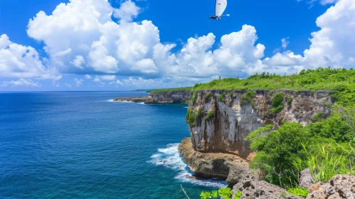 Windsurfer Flying Over Cliffs with Blue Sea and Sky | Enigmatic Tropics