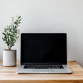 Elegant Laptop Setup on Wooden Table