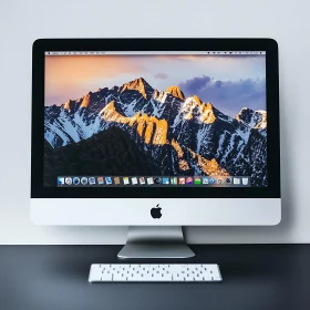 iMac Desk Setup with Mountain Scenery