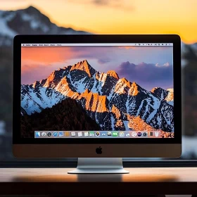 Desktop Monitor with a Stunning Sunset Mountain Scene