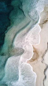 Ocean Waves Meeting Sandy Beach Aerial Image