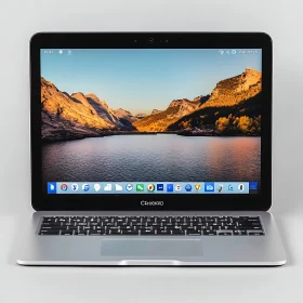 Sleek Laptop with Mountain and Lake Wallpaper