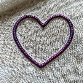 Embroidered Heart on Beige Textile