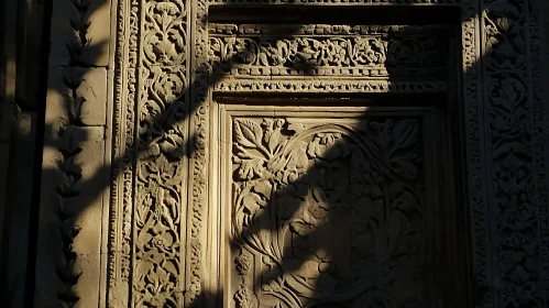 Shadowed Stone Carving with Floral Motifs