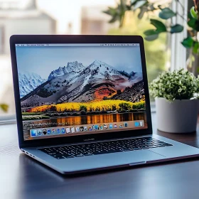 Peaceful Desk Setup with Mountain View Laptop Screen