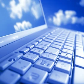 Laptop Keyboard with Cloud Reflections
