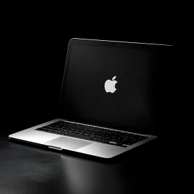 Sleek Laptop Illuminated on a Dark Background