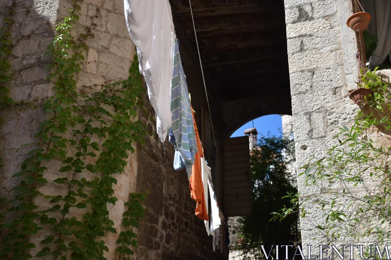 Sunlit European Alleyway Scene Free Stock Photo