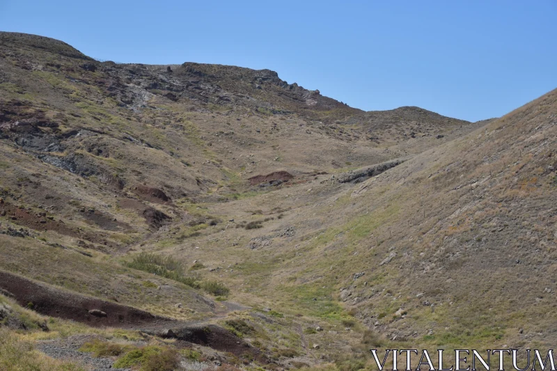 PHOTO Rugged Hills and Blue Sky