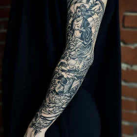 Artistic Monochrome Arm Sleeve Tattoo Design