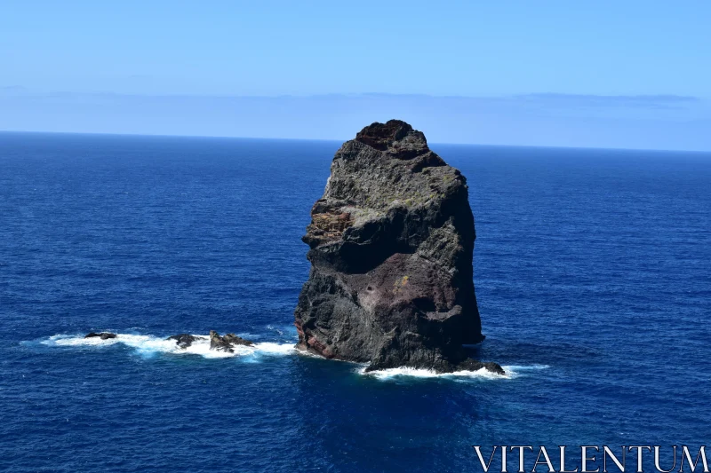 Solitary Sea Rock in Vast Ocean Free Stock Photo