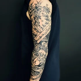 Detailed Floral and Abstract Arm Tattoo