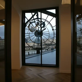 Urban View Through Clock Window