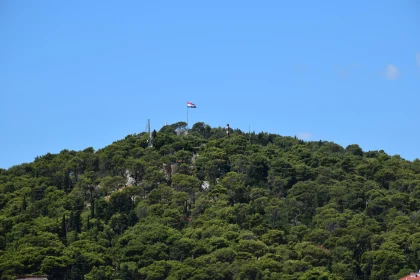 Scenic Croatian Hilltop with National Flag