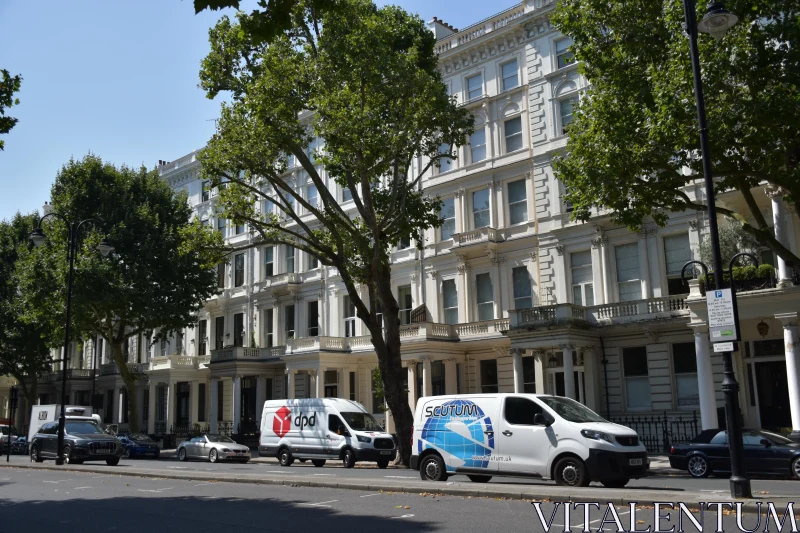 Urban Afternoon with Classic Architecture and Delivery Vehicles Free Stock Photo