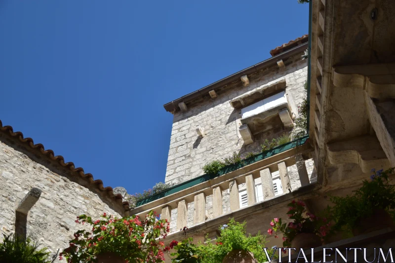 PHOTO Historic Stone Architecture with Balconies