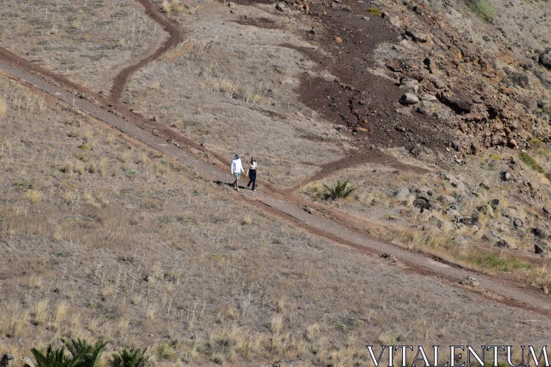 PHOTO People Walking on a Dirt Path