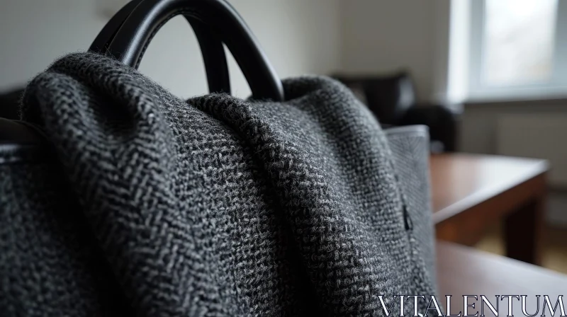 Gray Woolen Scarf on Black Leather Bag | Stylish Fashion Accessory AI Image