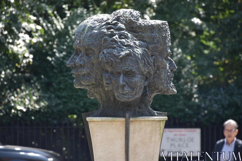 PHOTO Bronze Sculpture of Human Faces