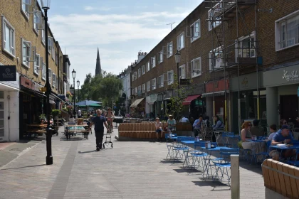 Pedestrian Street with Cafés and Shoppers